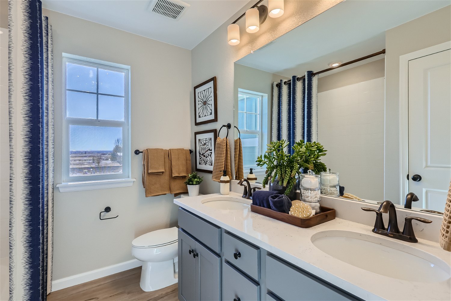A bathroom with a tub sink and toilet.