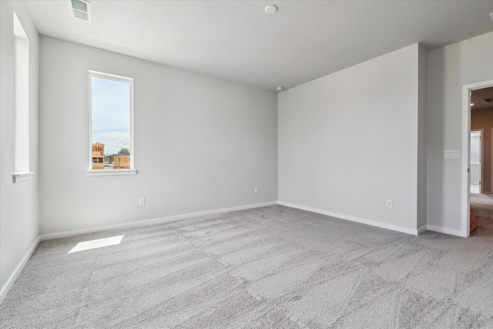 A room with a painting on the wall.