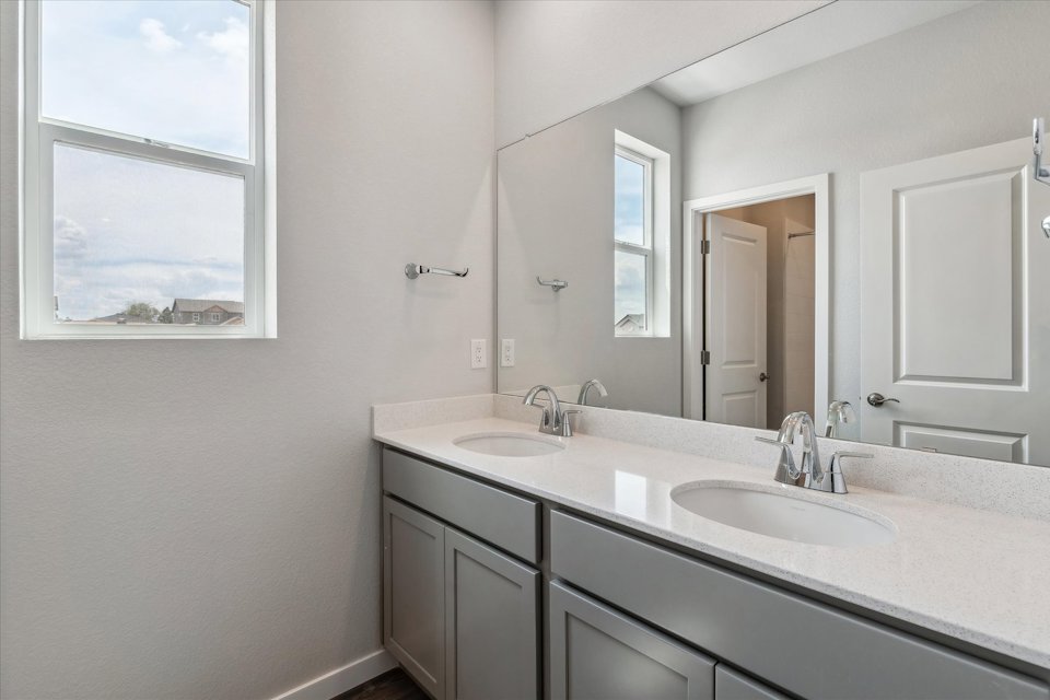 A bathroom with two sinks.