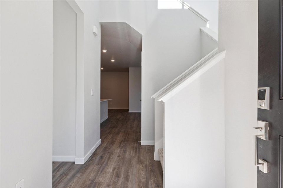 A hallway with white walls.