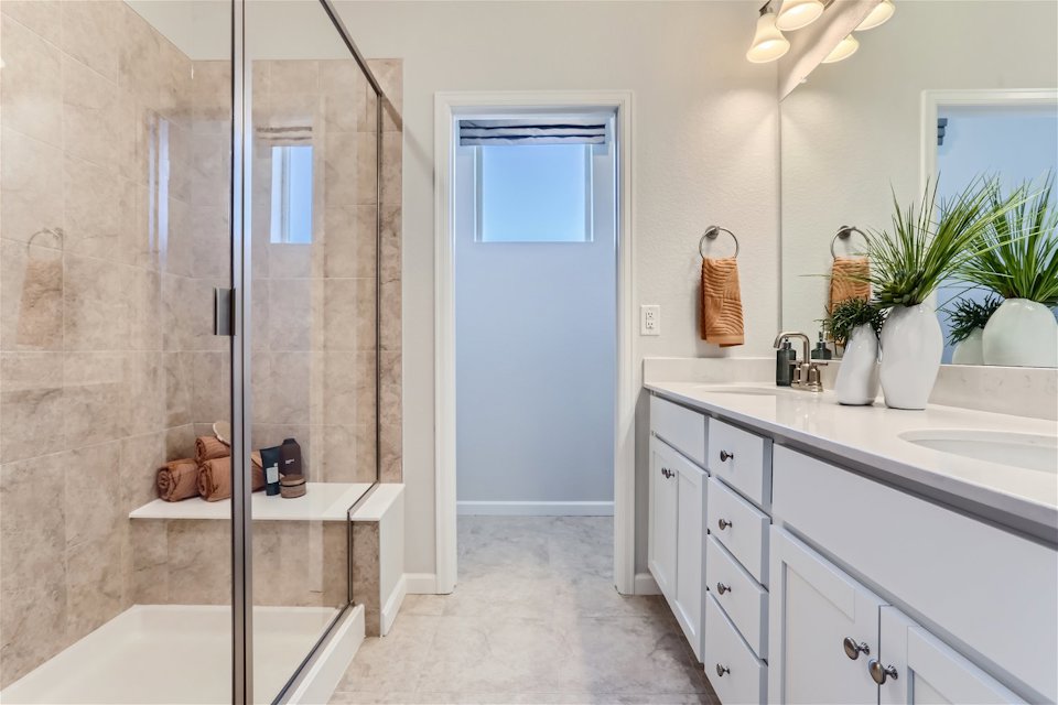 A bathroom with a glass shower.