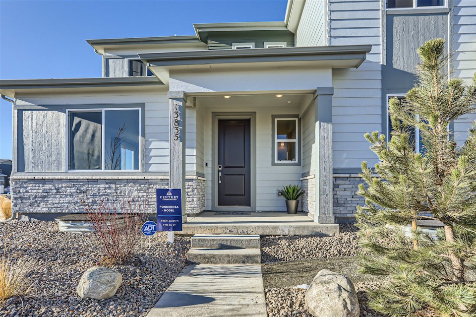 A house with a sign in front.