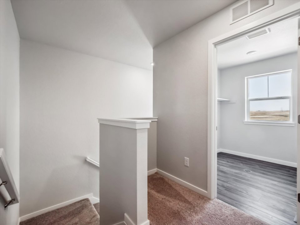 A room with a sink and a window.