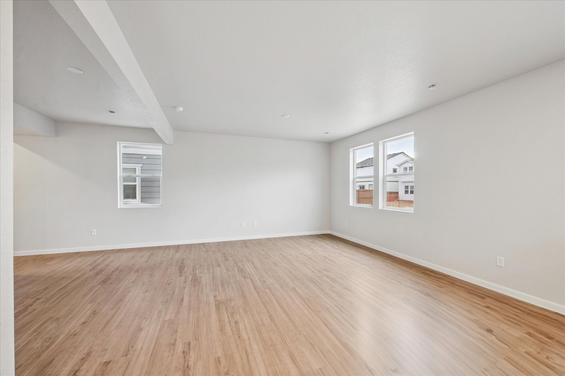 A room with a wood floor and a wood floor.