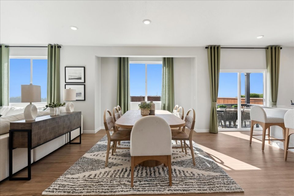 A room with a table and chairs.