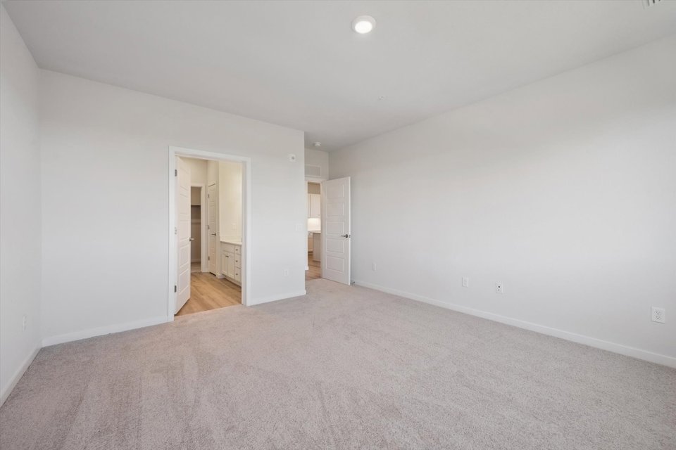 A hallway with white walls.