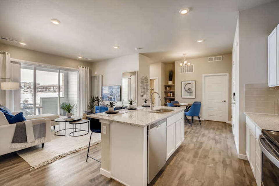 A kitchen with a tub and sink.