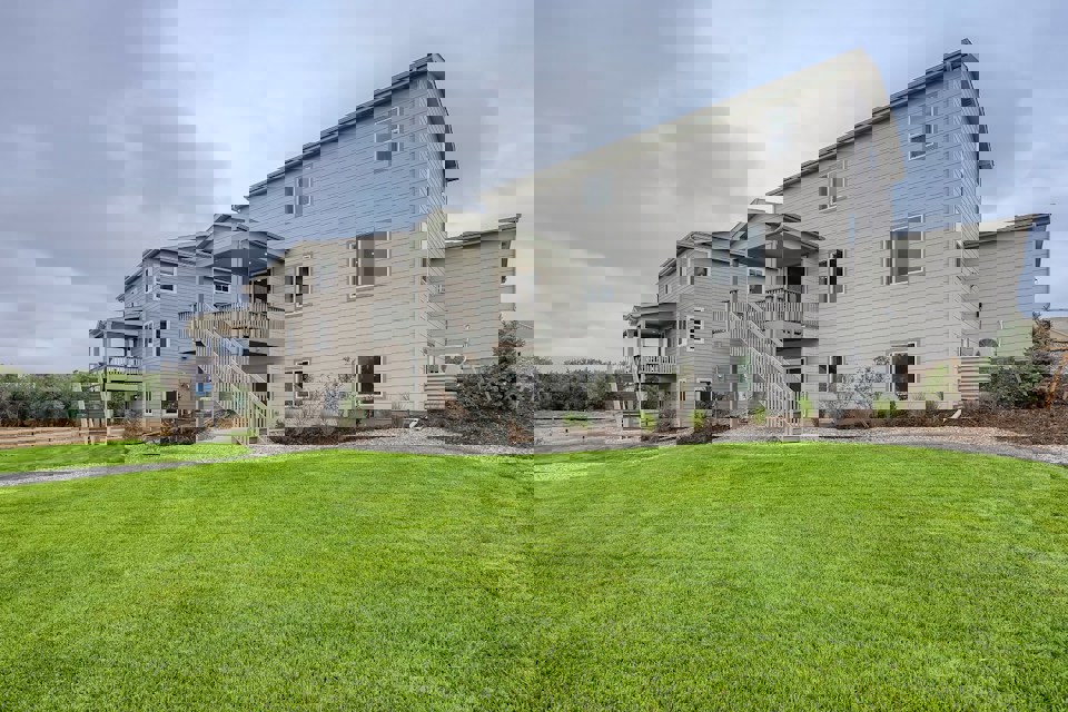 A house with a lawn in front of it.