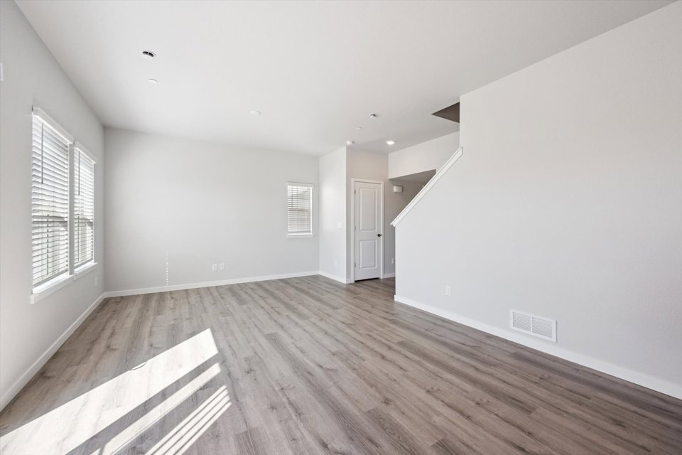 A room with a wood floor and a wood floor.