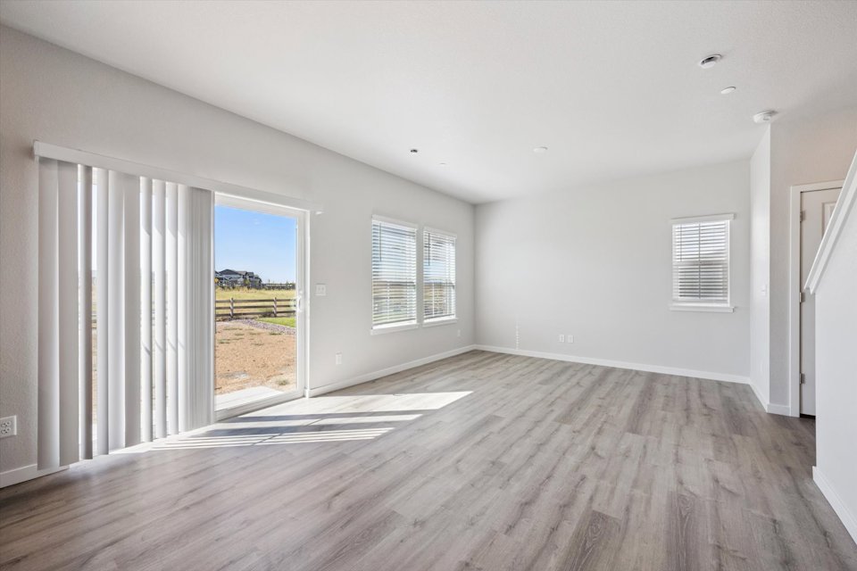 A room with a wood floor and a wood floor.