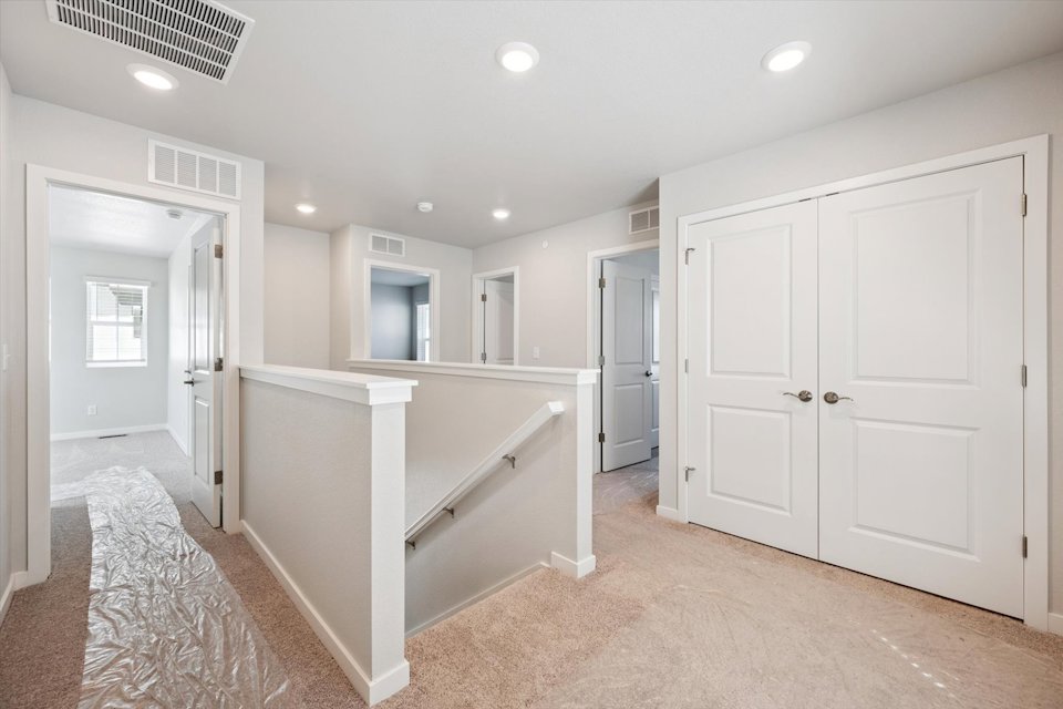 A large white room with white cabinets.