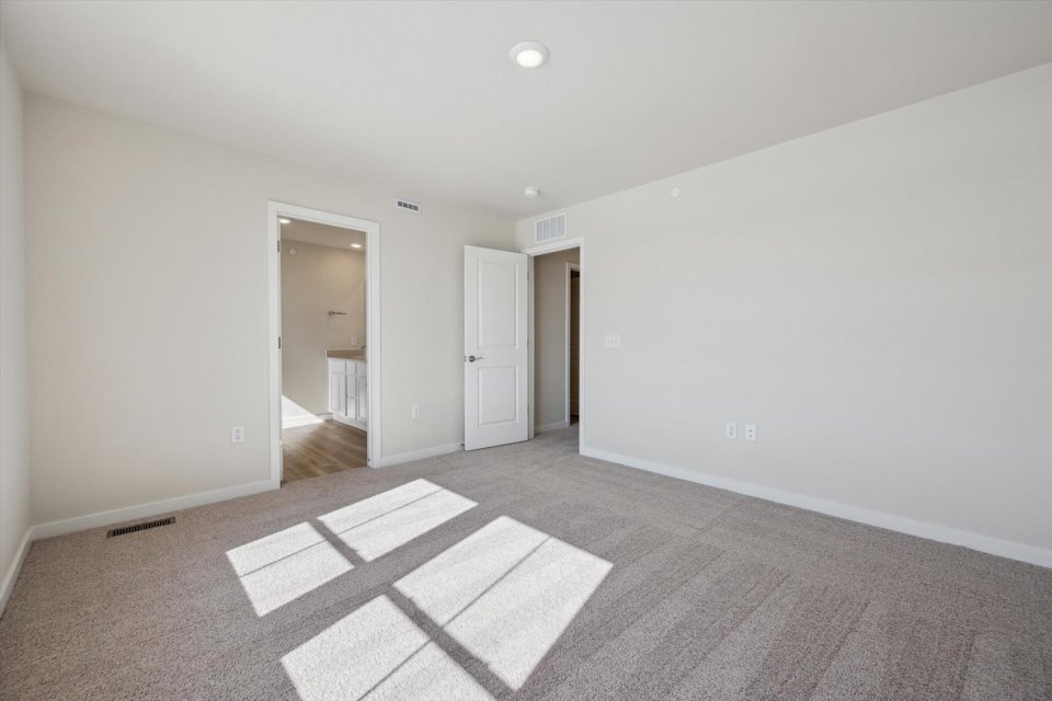 A hallway with white walls.