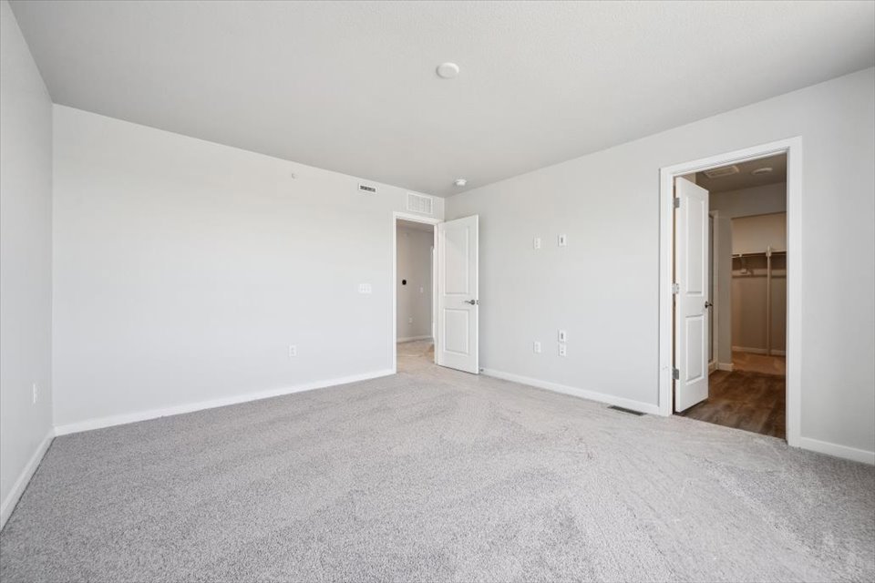 A long hallway with white walls.
