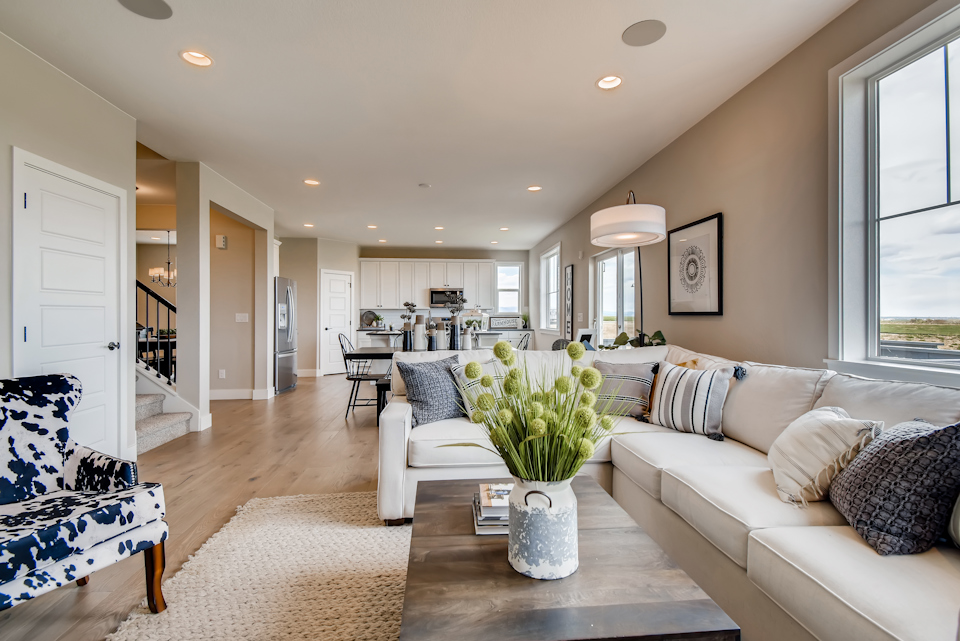 A living room with a couch and a table.