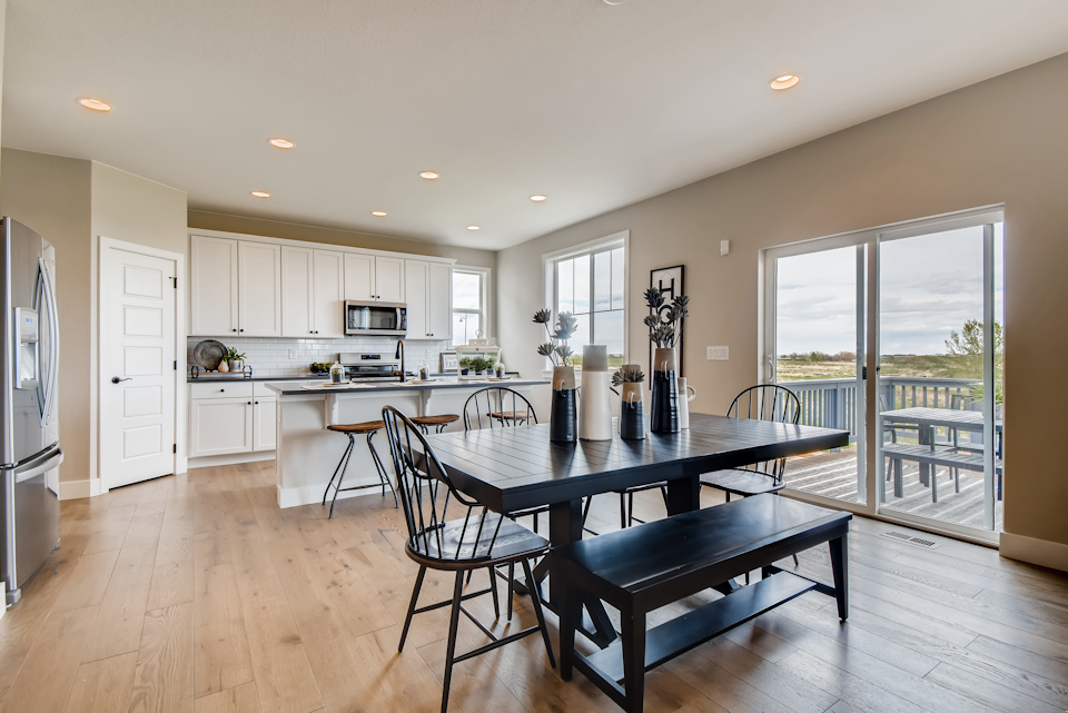 A kitchen with a dining table.