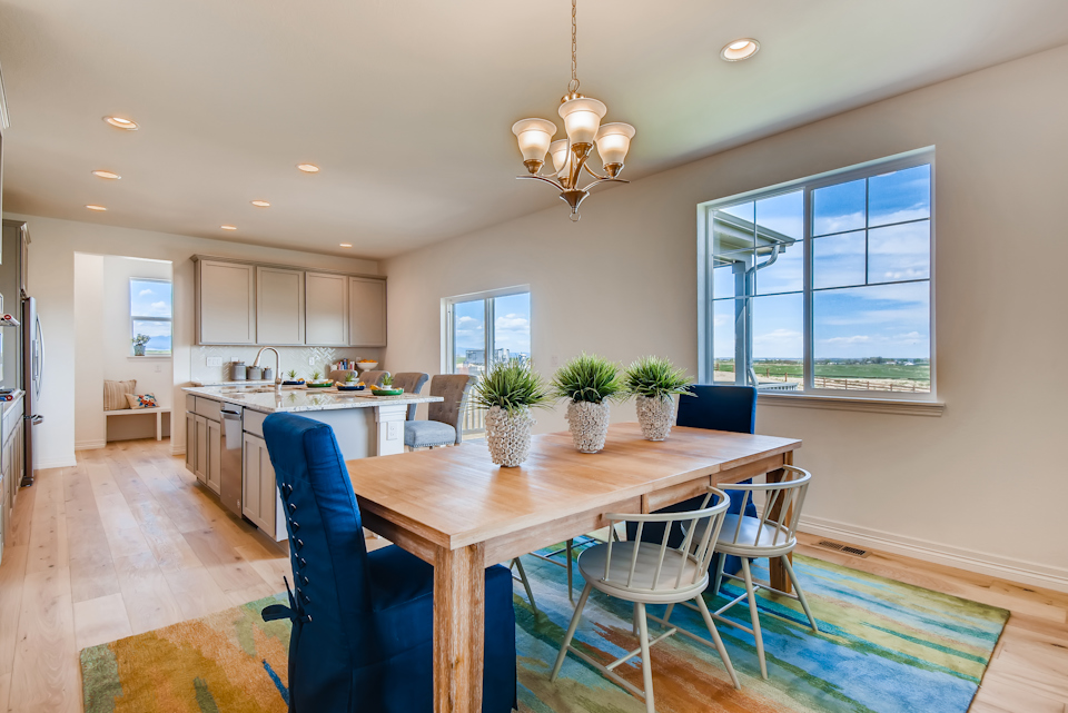 A kitchen with a dining table.