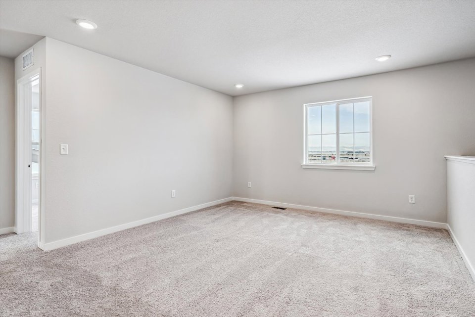 A room with a window and a door.