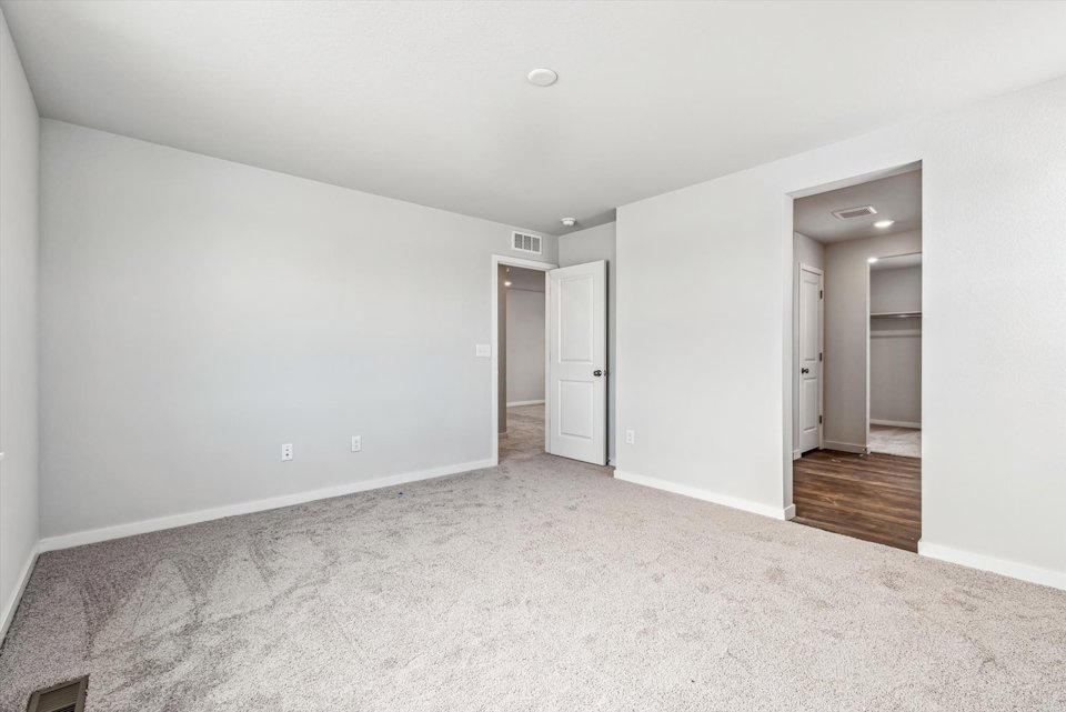 A hallway with white walls.
