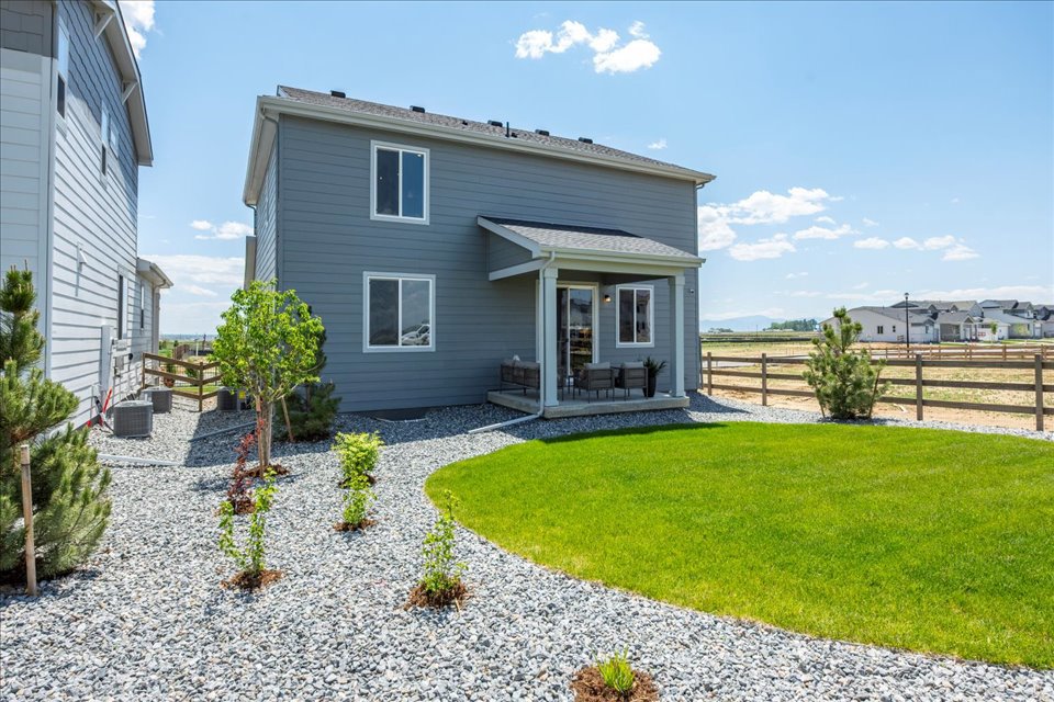 A house with a fence and yard.