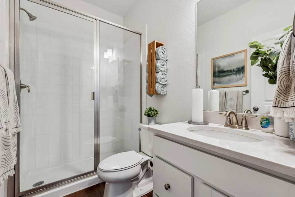 A bathroom with a glass shower.