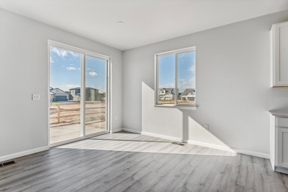 A room with a large glass door.