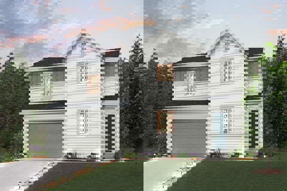A white house with a garage.