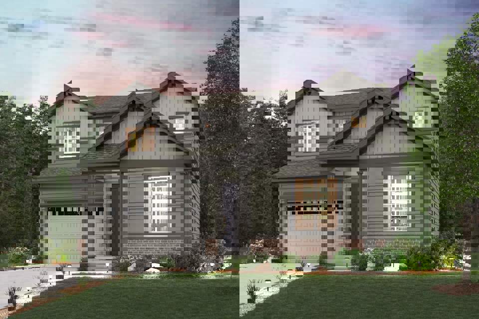 A house with a lawn and trees around it.