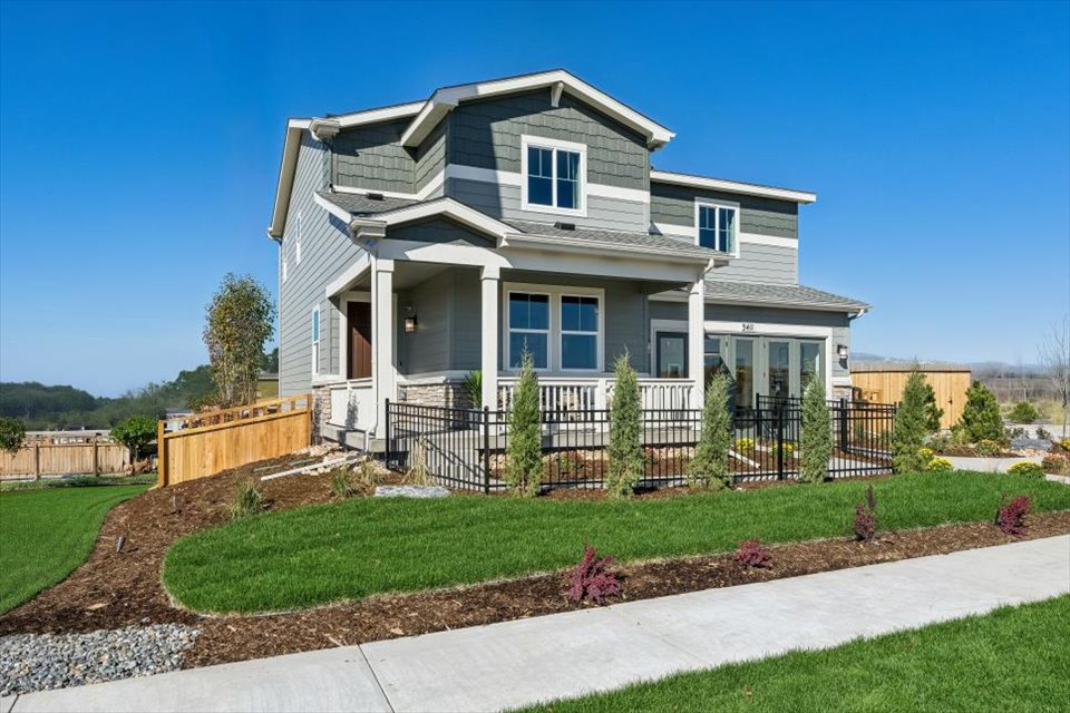 A house with a fence and yard.