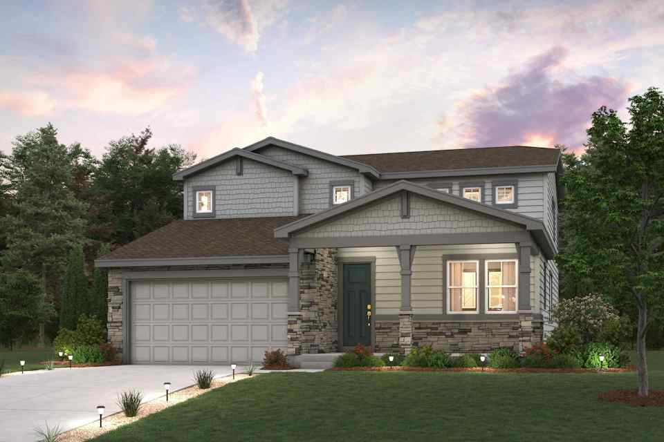 A house with a garage and trees.