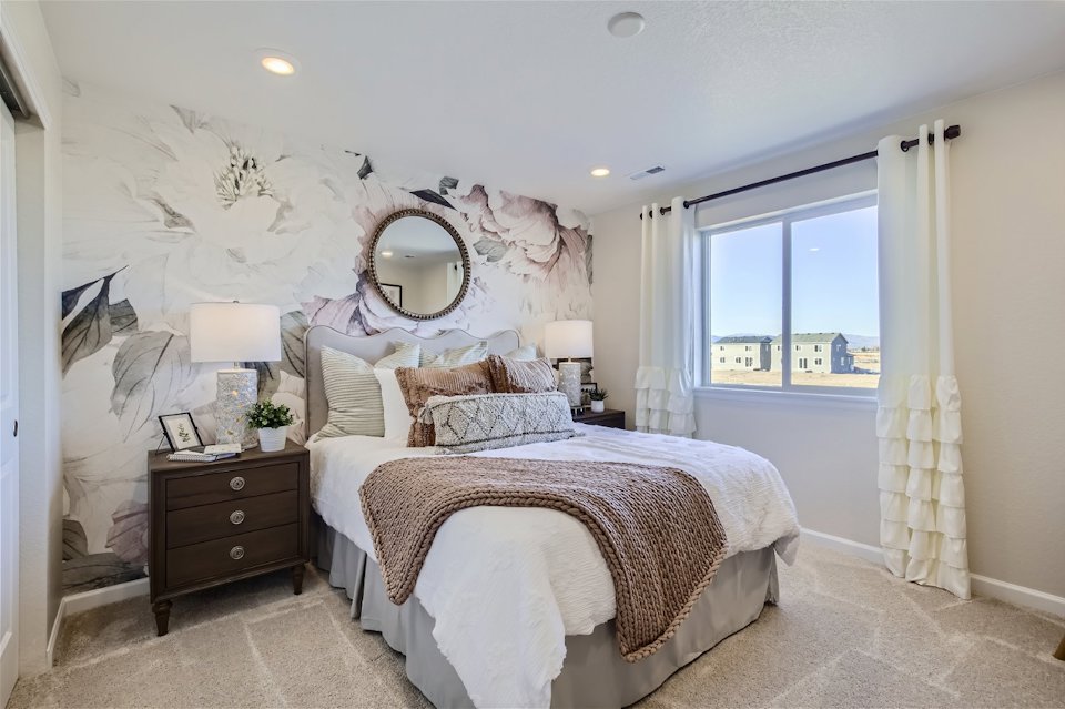 A bedroom with a large bed.
