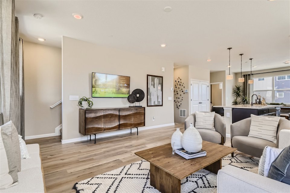 A living room with a tv and couches.