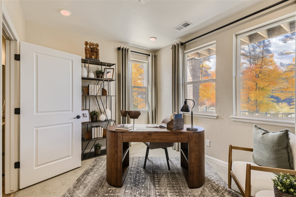 A room with a table and chairs.
