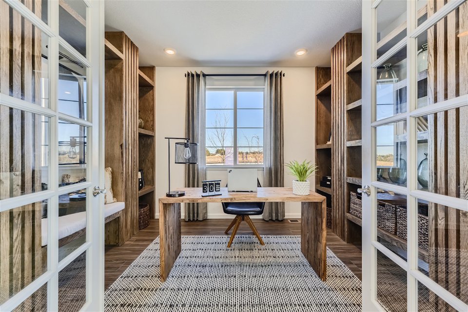 A room with a table and chairs.