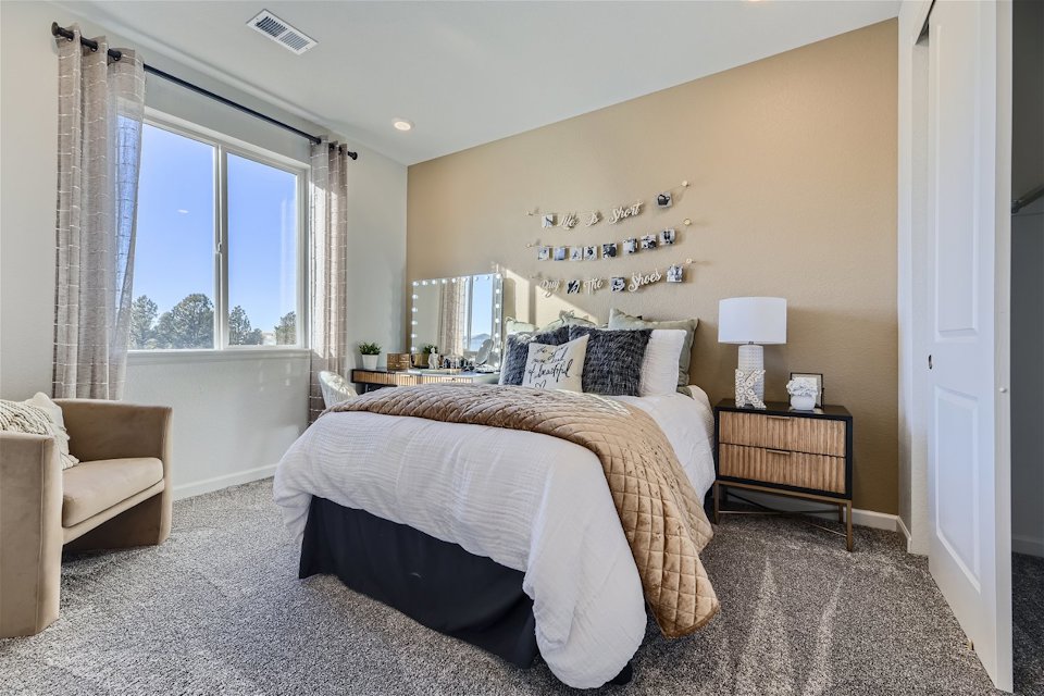 A bedroom with a large bed.