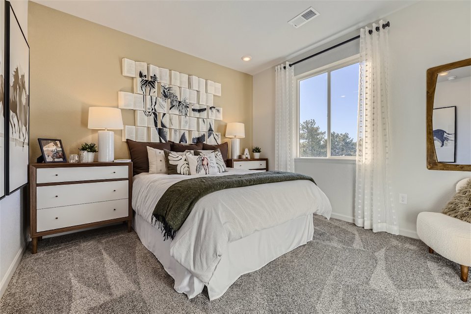 A bedroom with a large bed.