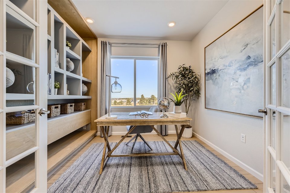 A room with a table and shelves.