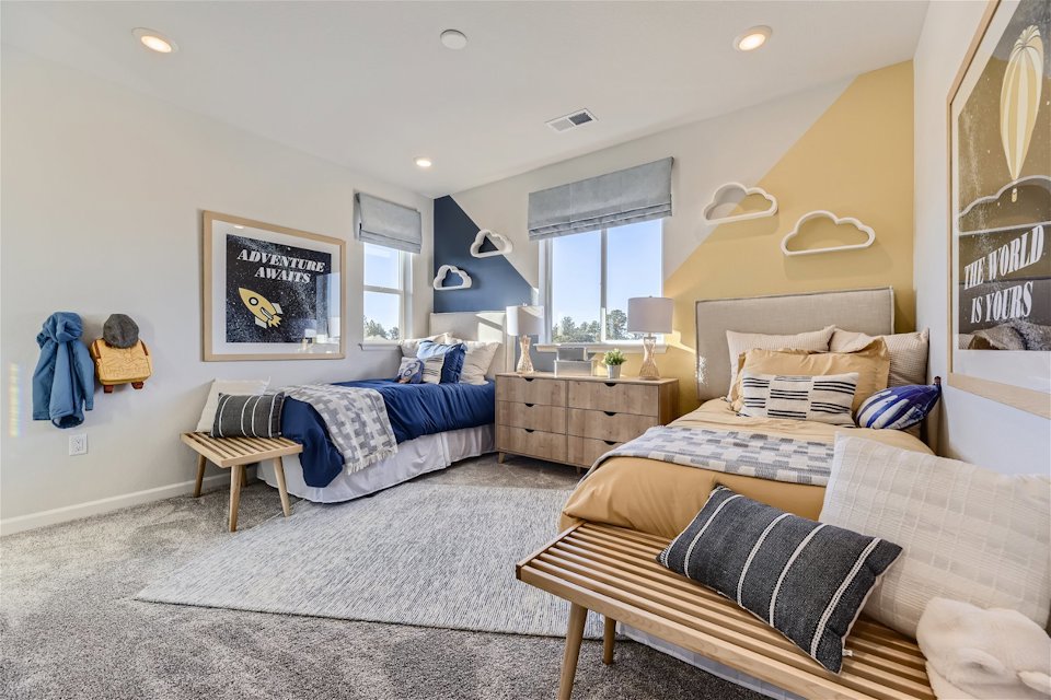 A bedroom with a bed and a couch.