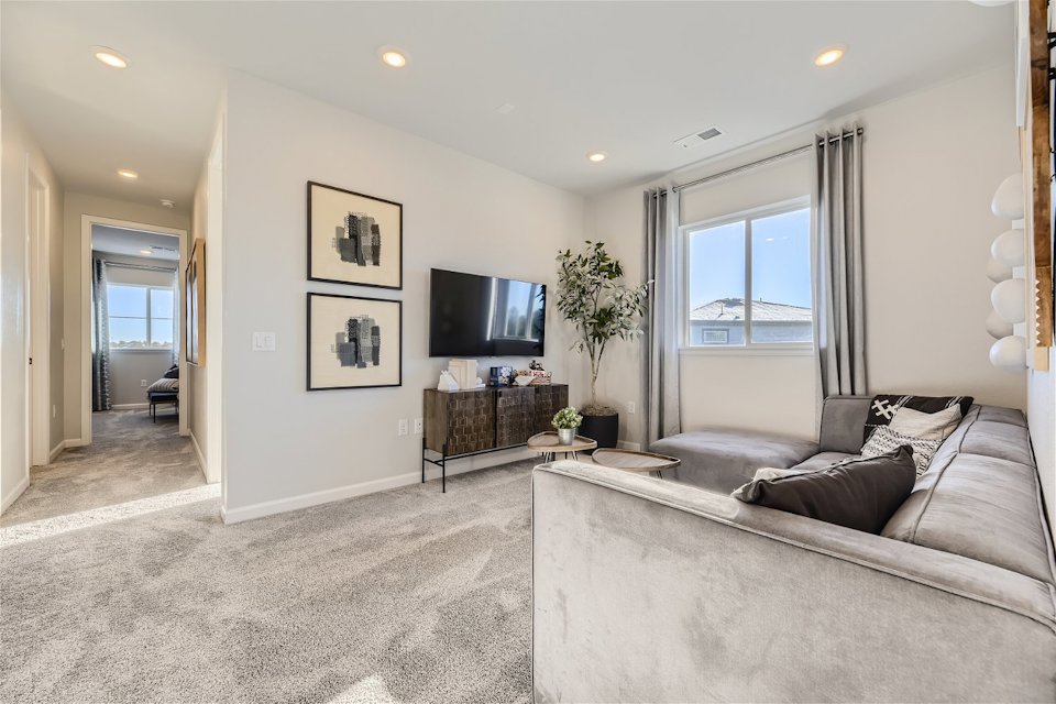 A living room with a tv and couches.