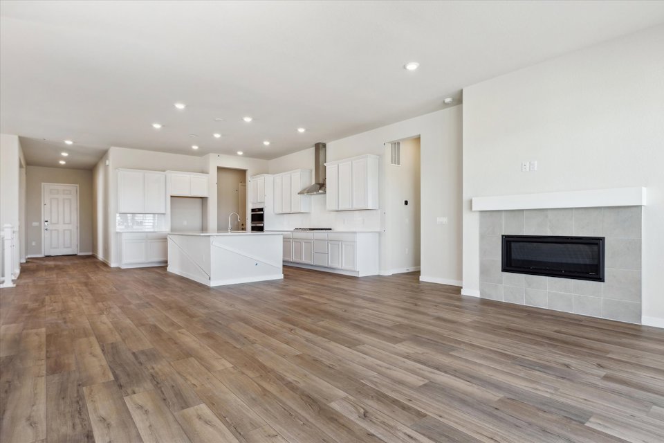 A large kitchen with white cabinets.
