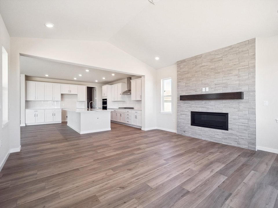 A large kitchen with a fireplace.
