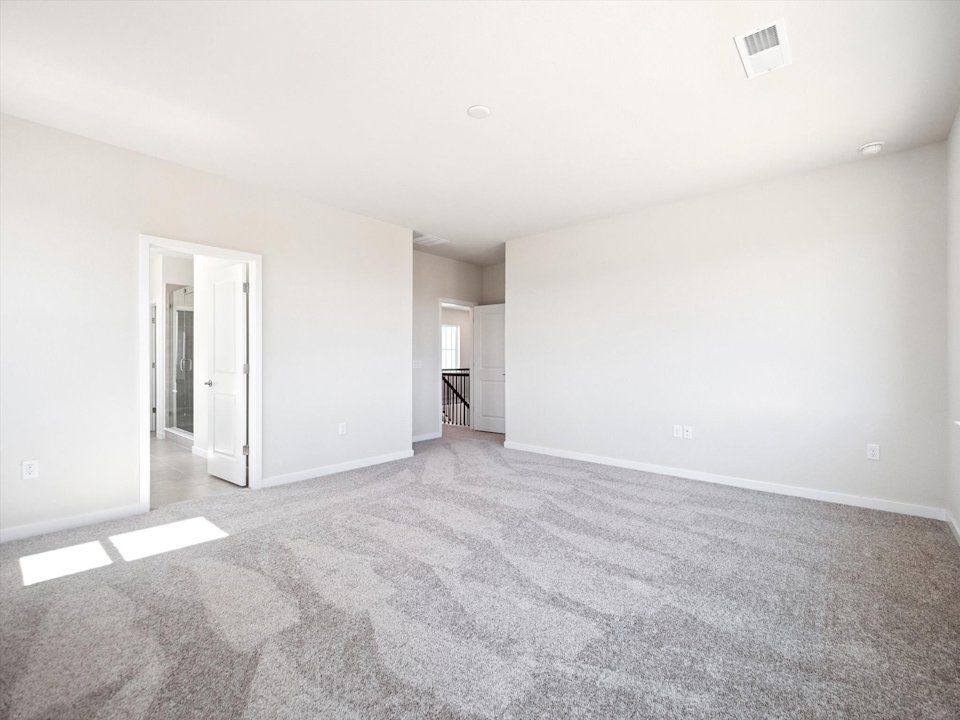 A long hallway with white walls.