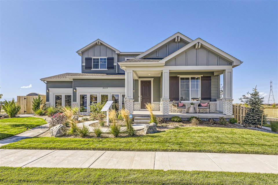 A house with a lawn and a walkway.