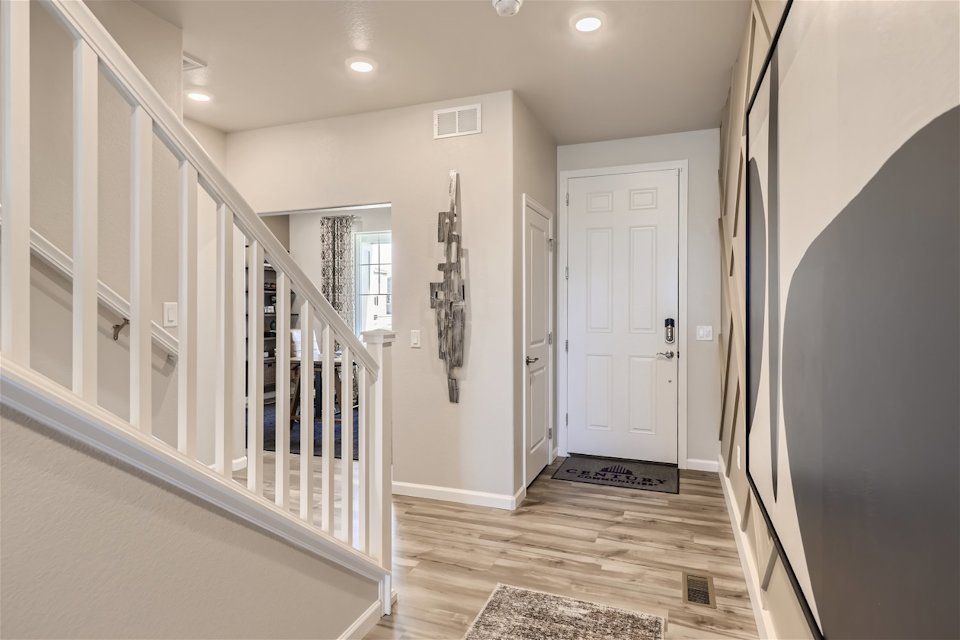 A hallway with white walls.