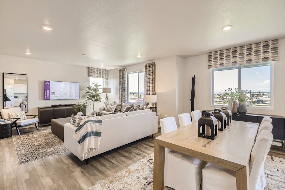 A large bedroom with a large window.