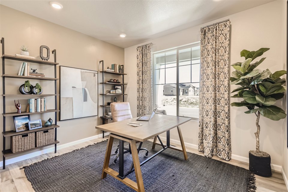 A room with a table and shelves.