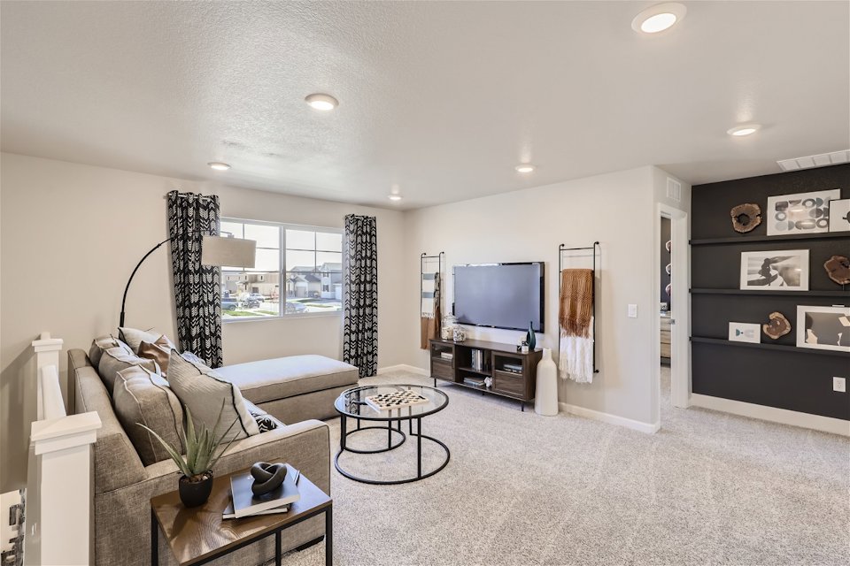 A living room with a tv and couches.