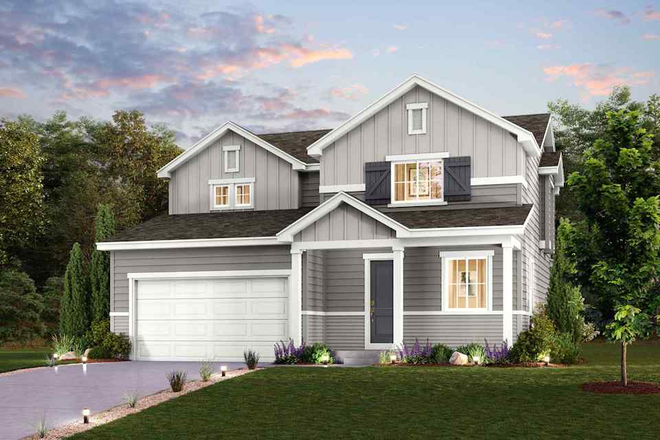 A house with a driveway and trees.