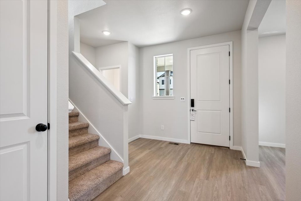 A hallway with white doors.