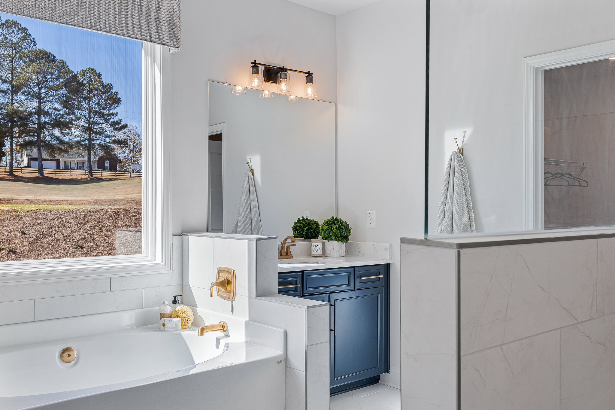 A bathroom with a tub and sink.