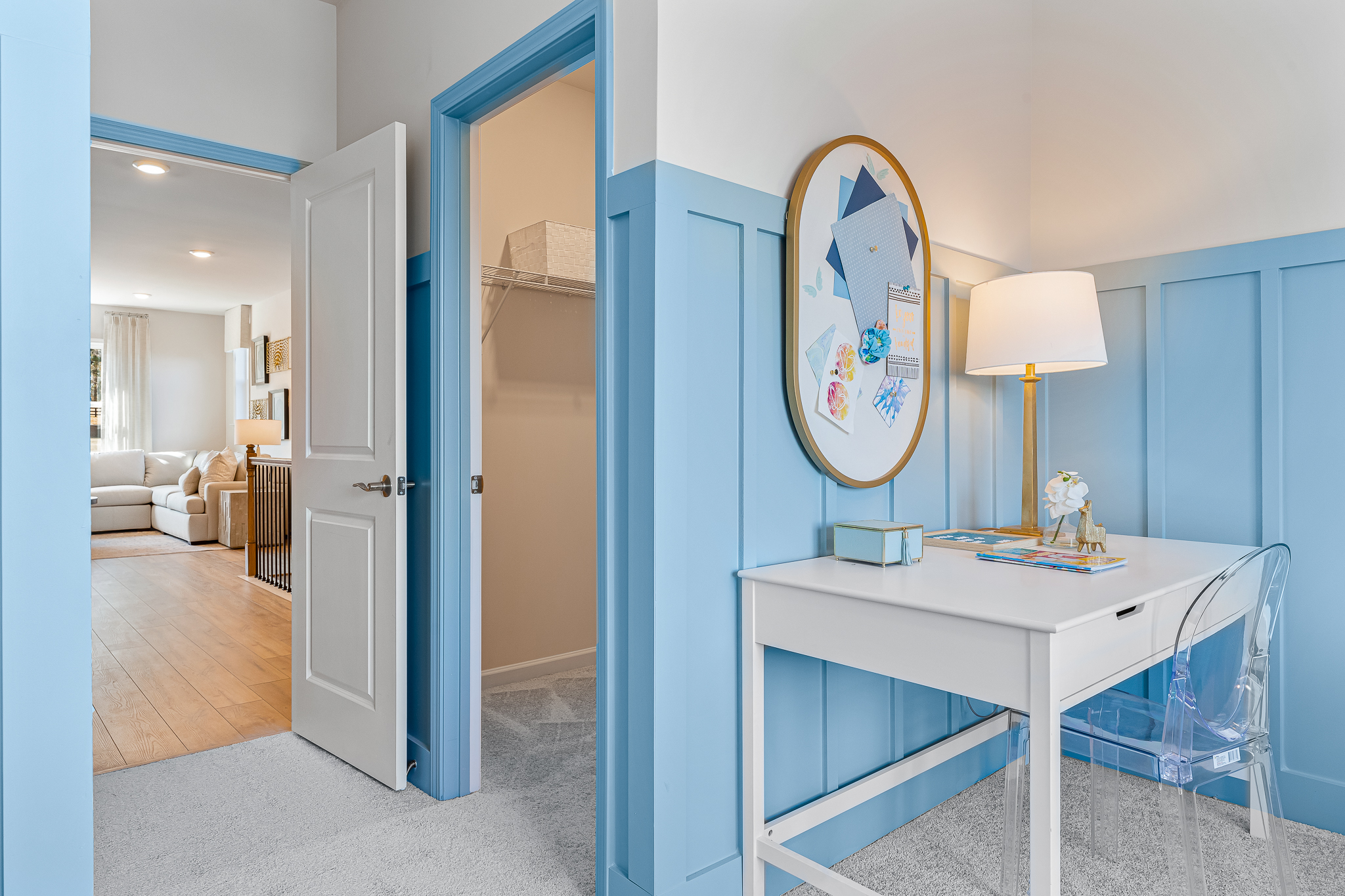 A room with a table and a mirror.